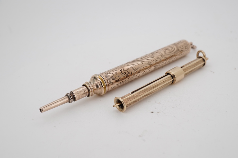 A 9ct gold propelling toothpick, 50mm and a yellow metal propelling pencil.